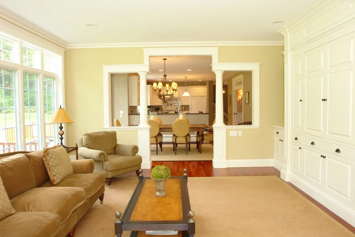 A living room with a couch and chairs and a coffee table
