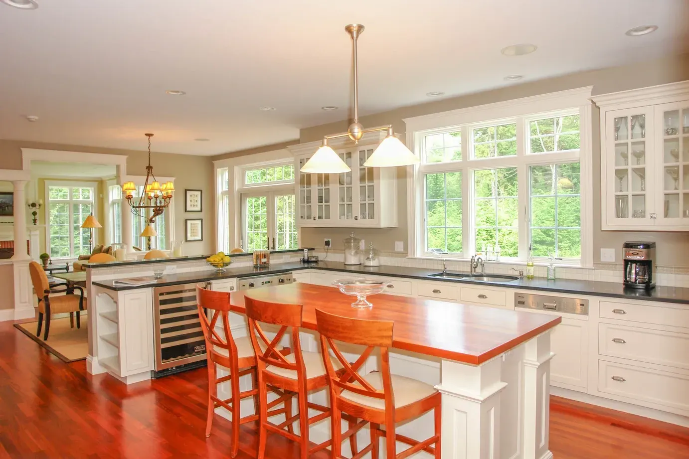 A large kitchen with a large island and stools