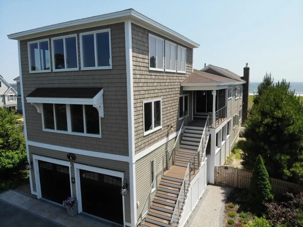 A large house with stairs leading up to the second floor