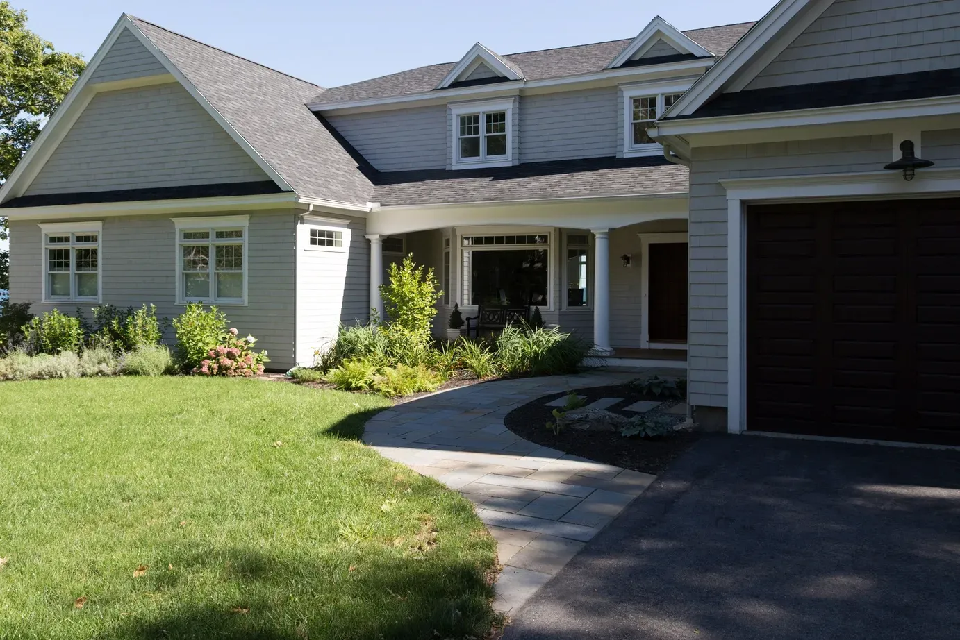 A large house with a driveway leading to it