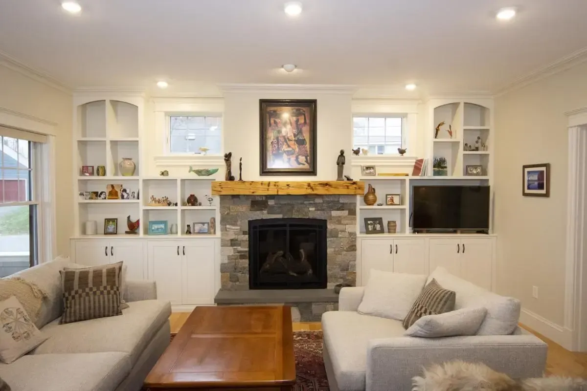 A living room with a fireplace and a couch