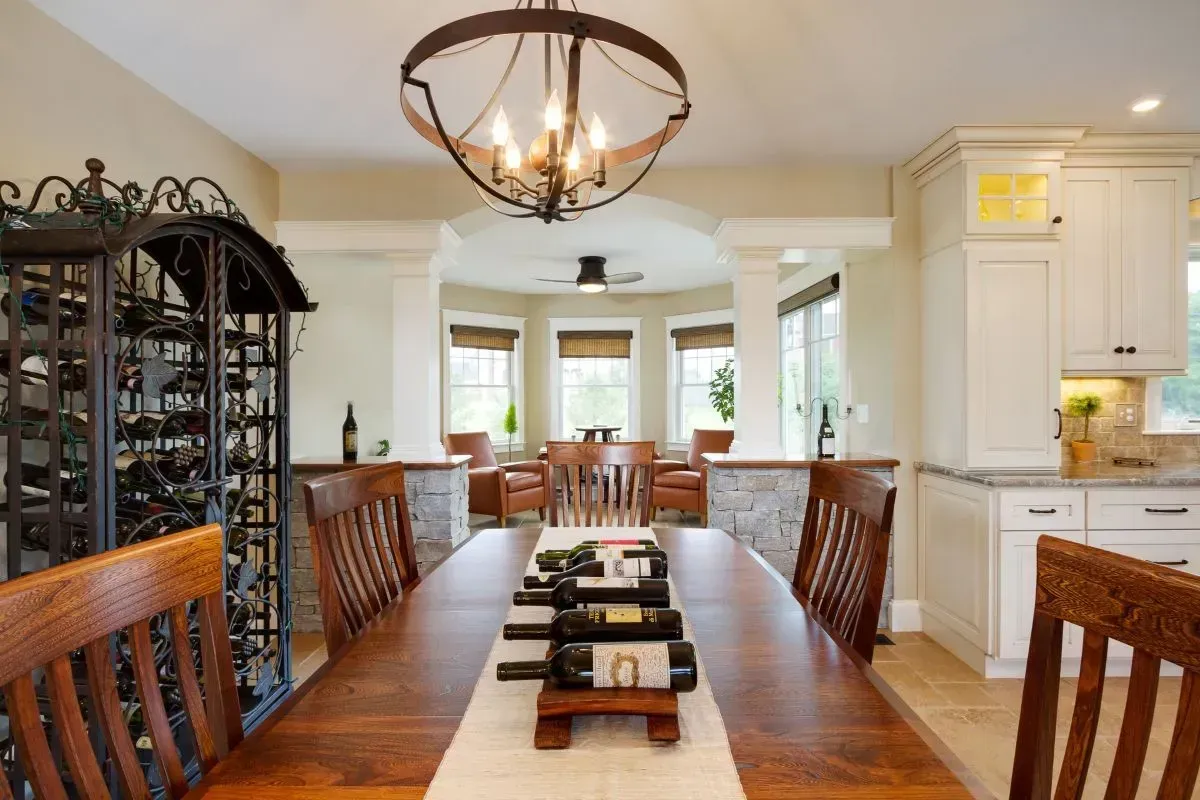 A dining room table with bottles of wine on it