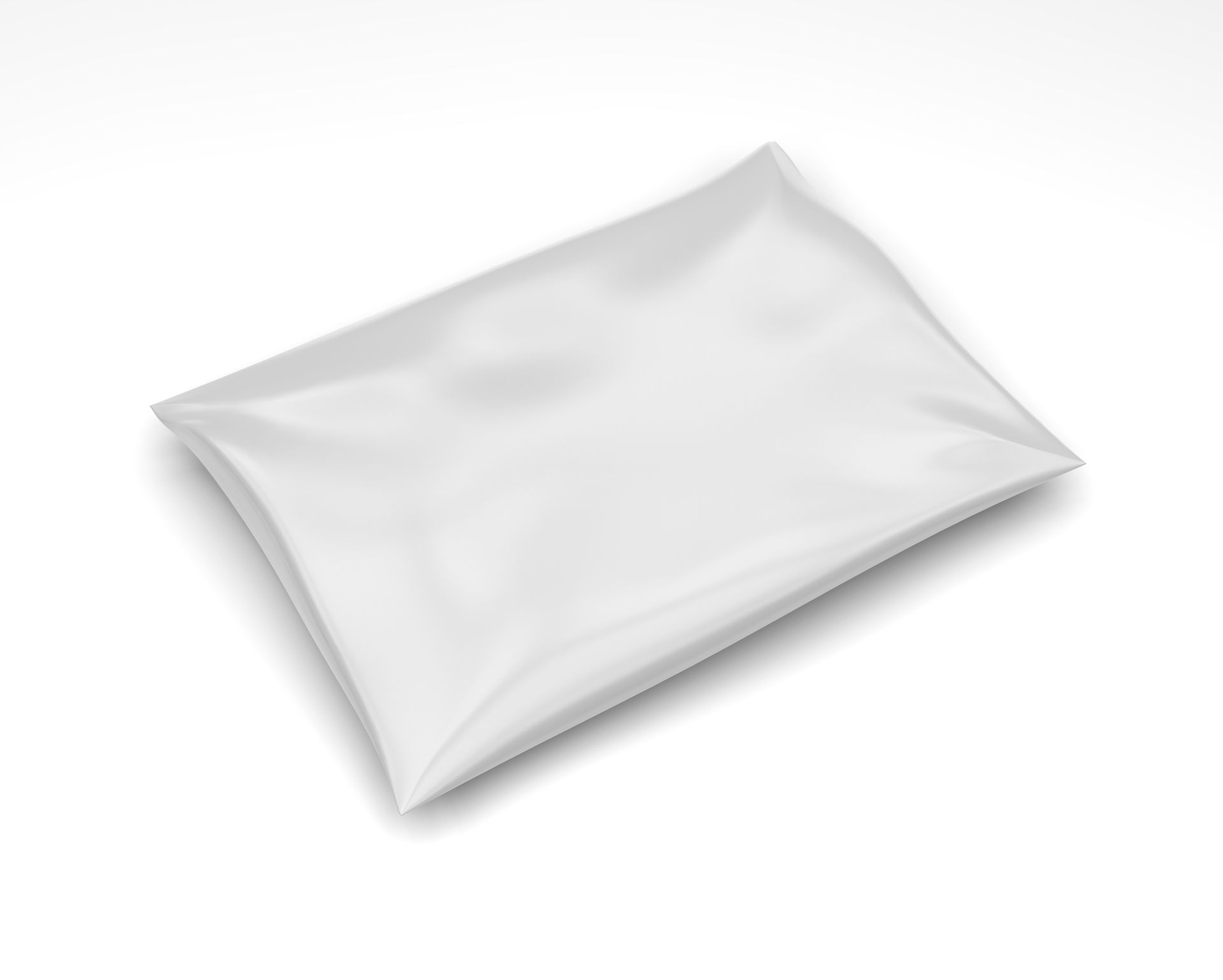 White, rectangular, sealed pouch laying on a white surface, possibly containing product.