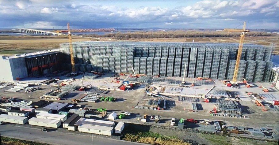 An aerial view of a large building under construction.