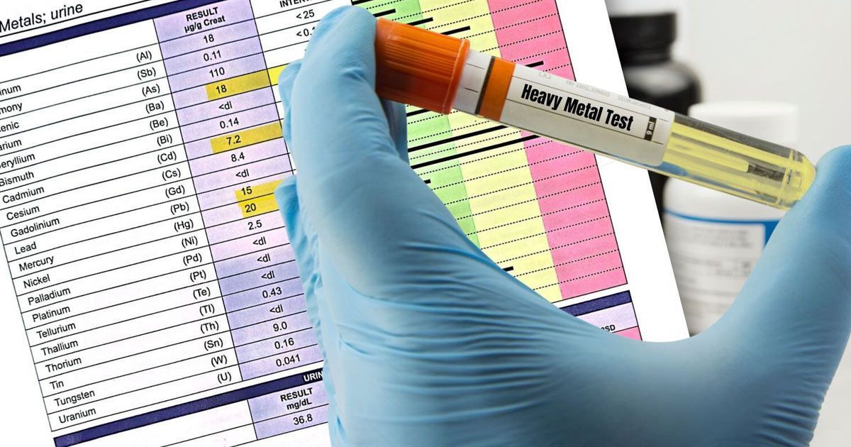 A person is holding a test tube with heavy metals written on it representing Heavy Metal Detoxification NYC by Dr. John Salerno