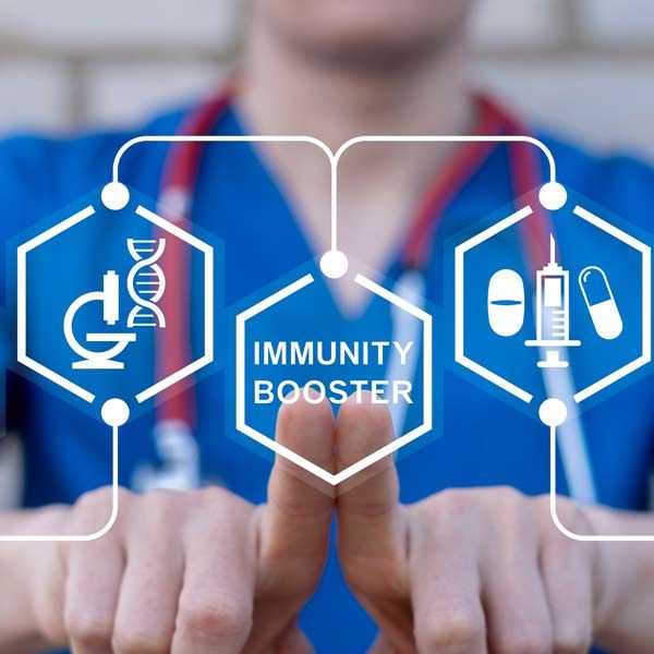 A nurse is holding up a screen that says immunity booster representing Immune Boosting IV Treatments