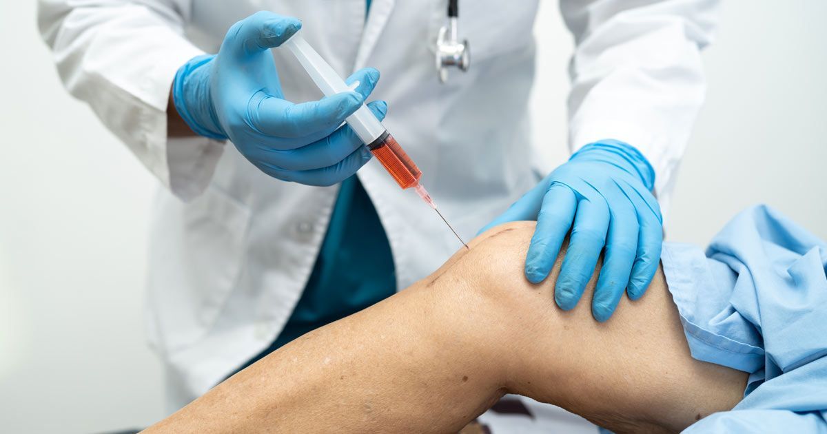 A doctor is administering an injection in the patient's knee of Stem Cell Therapy NYC by Dr. John Salerno