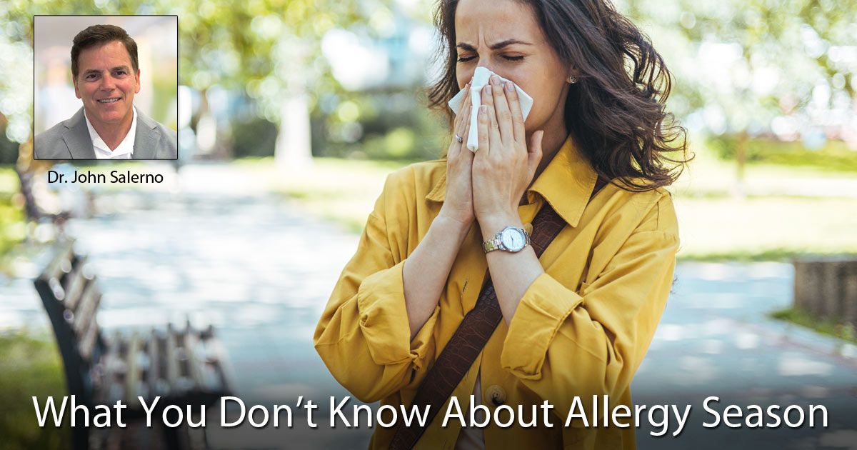 A woman is blowing her nose into a napkin what You Dont Know About Allergy Season.