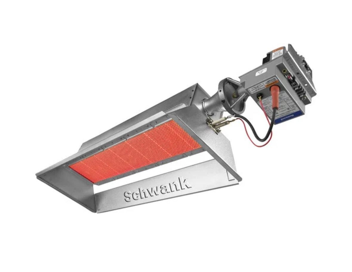 A stainless steel heater with a red light on it is on a white background.