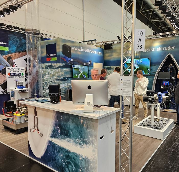 CEO of Jet Thruster working behind a computer at the Dusseldorf Boatshow