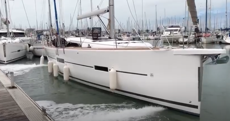 Dufour sailing yacht with activated Jet Thruster systems. Bow and Stern nozzles show the water jet as the boat moves sideway away from the dock