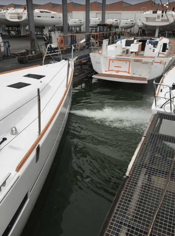 Jet Thruster Water jet visible, a Dufour Grand Soleil 460 is pushing water from the starboard water jet nozzle inside the Dufour test pool at the factory in Perigny France