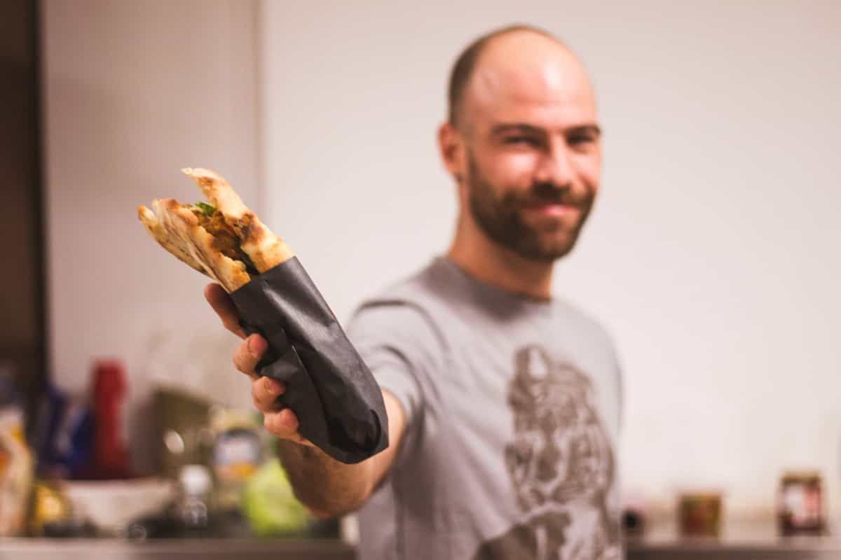 Chef holding focaccia wrap