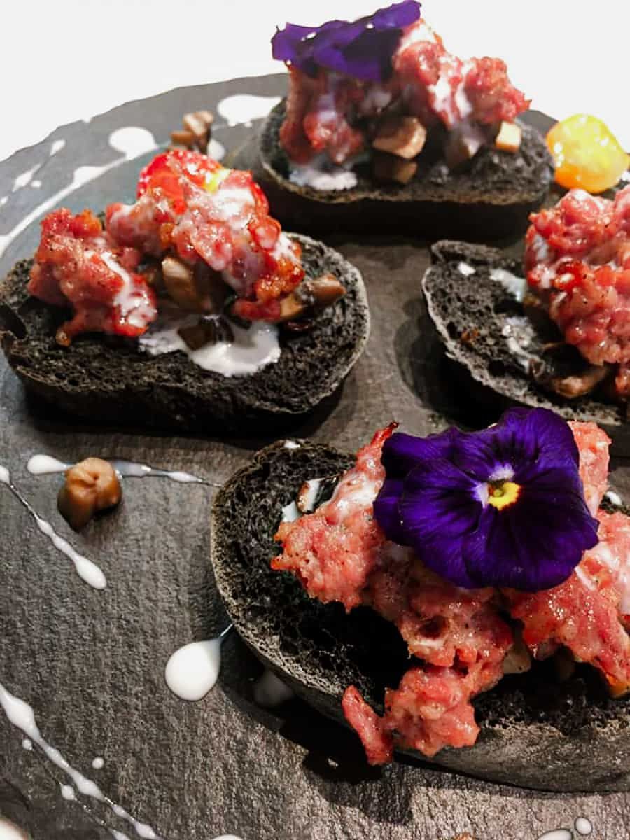 Black bruschetta with beef tartare
