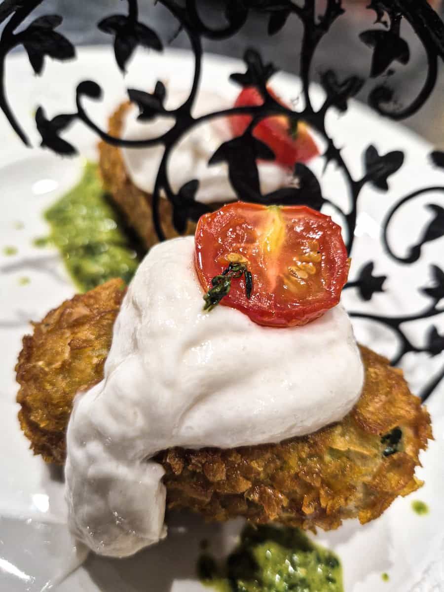 Plated dish behind decorative element
