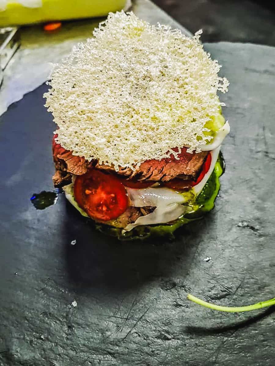 Plated dish with crisp garnish