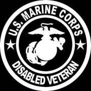 The u.s. marine corps disabled veteran logo is white on a black background.