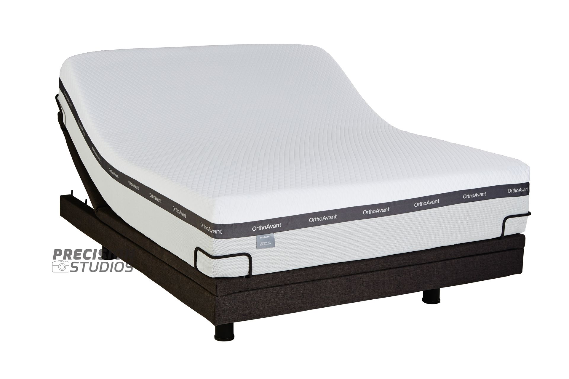 An adjustable bed with a white mattress on it