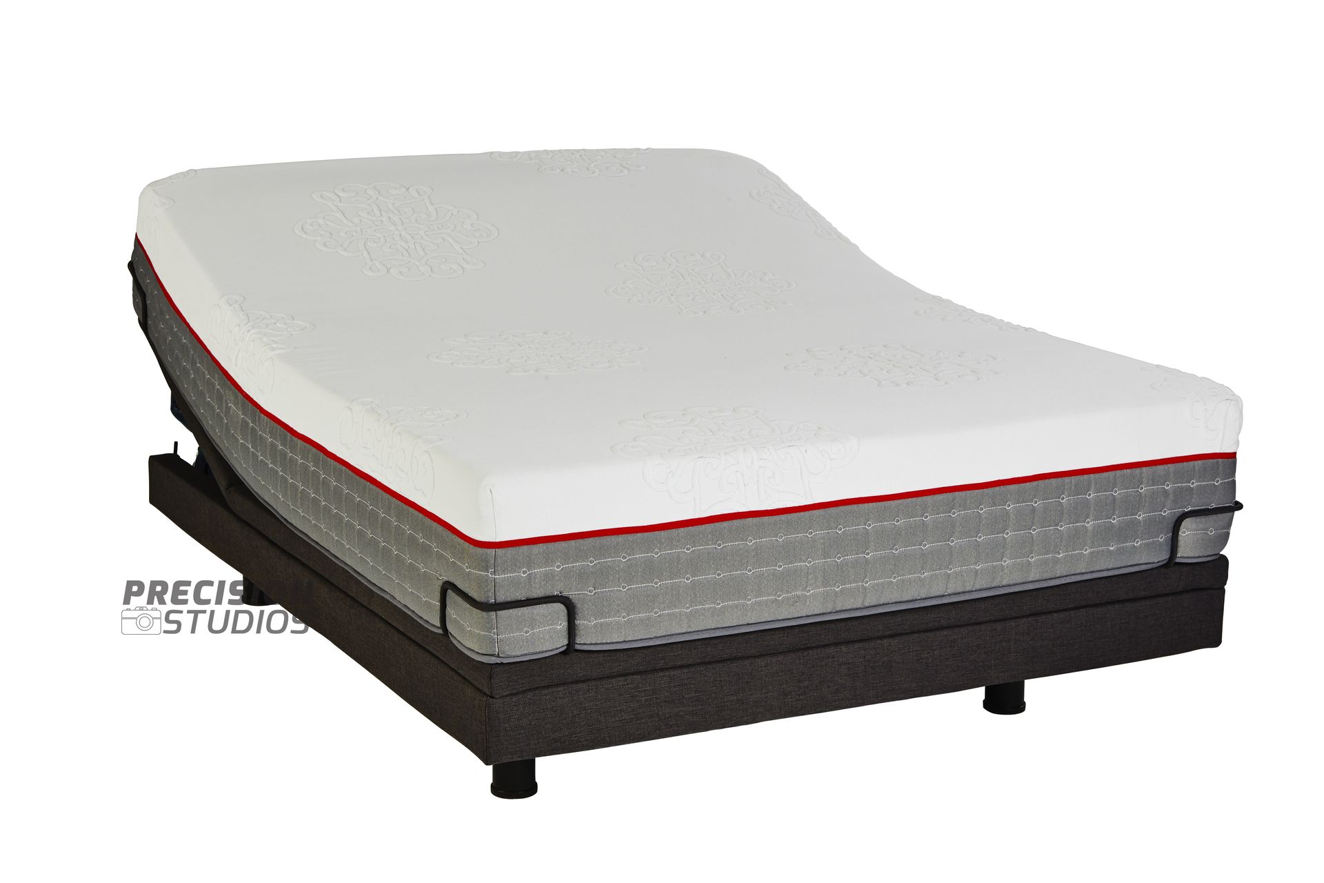 An adjustable bed with a mattress on top of it