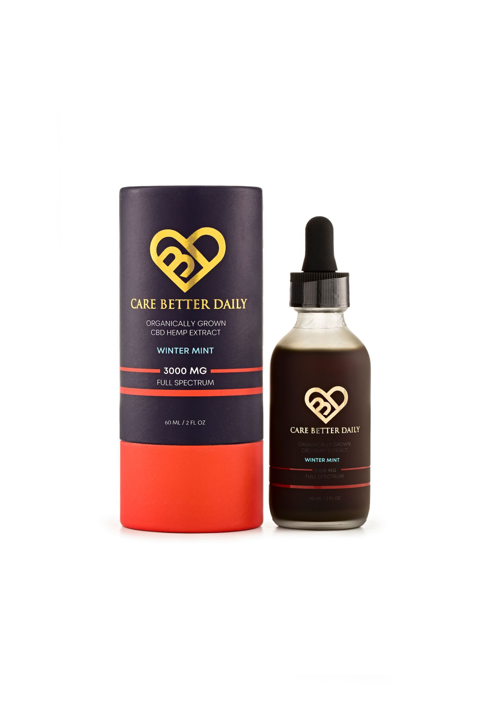 A bottle of essential oil next to a box with a heart on it.