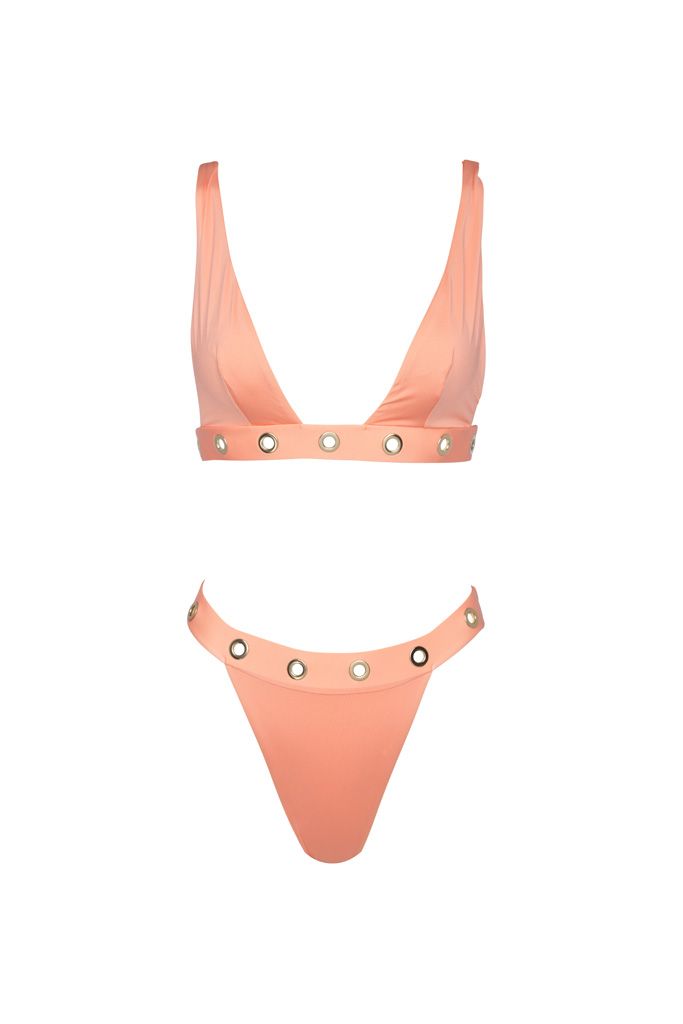 A pink bikini top and bottom with studs on a white background.