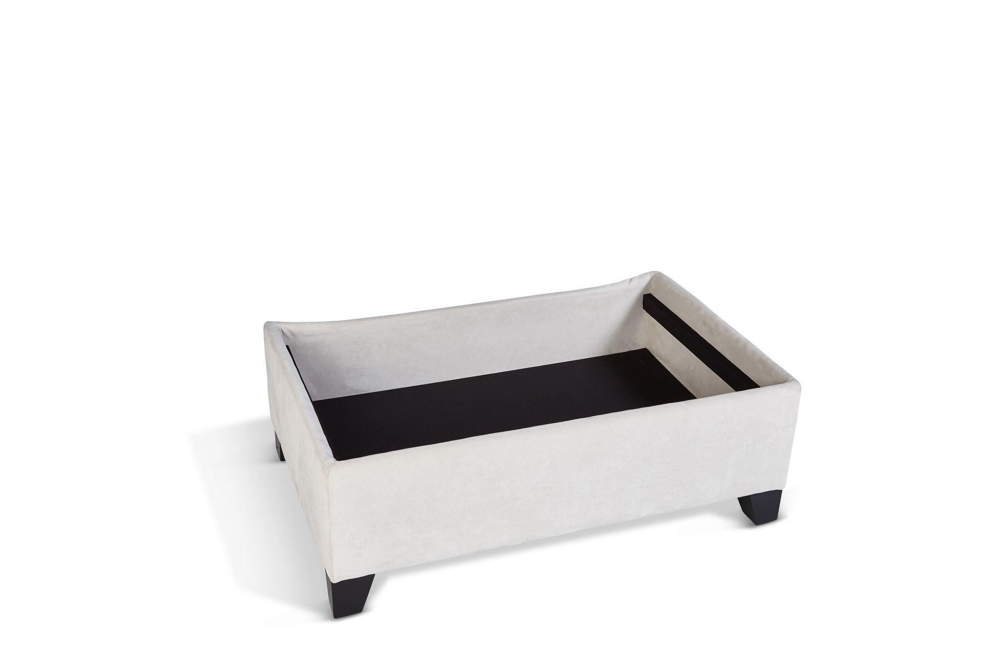 A white ottoman with black legs is sitting on a white surface.