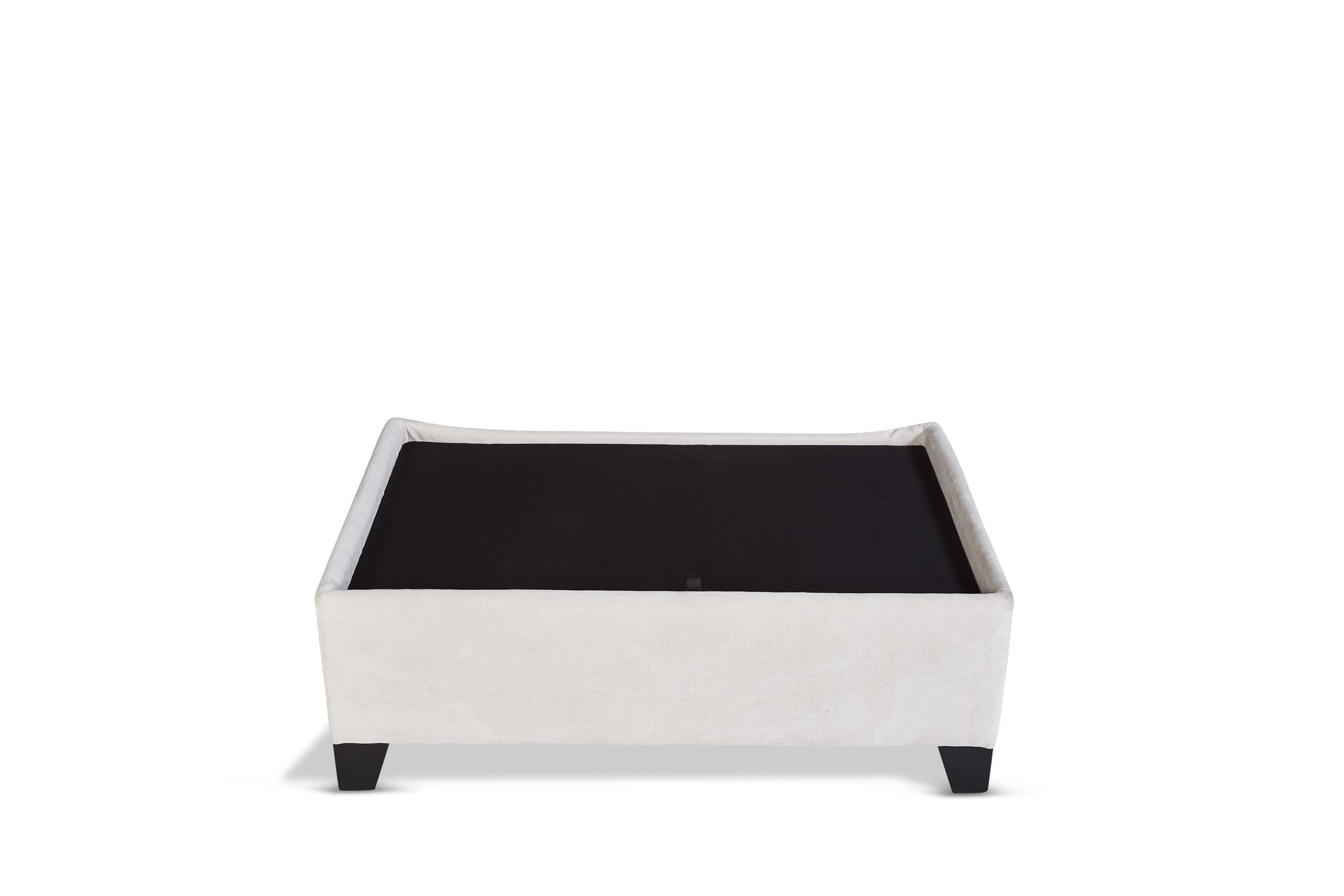 A white ottoman with a black top and black legs on a white background.