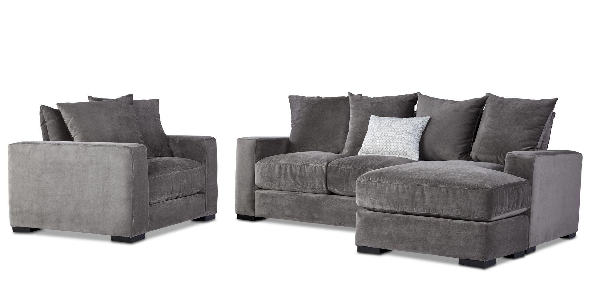 A living room set with a couch , chair , and ottoman.