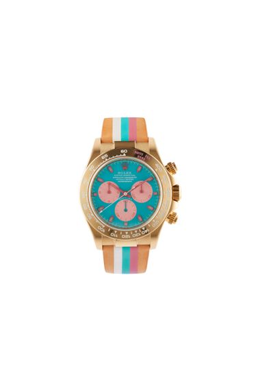 A colorful watch with a striped band on a white background.