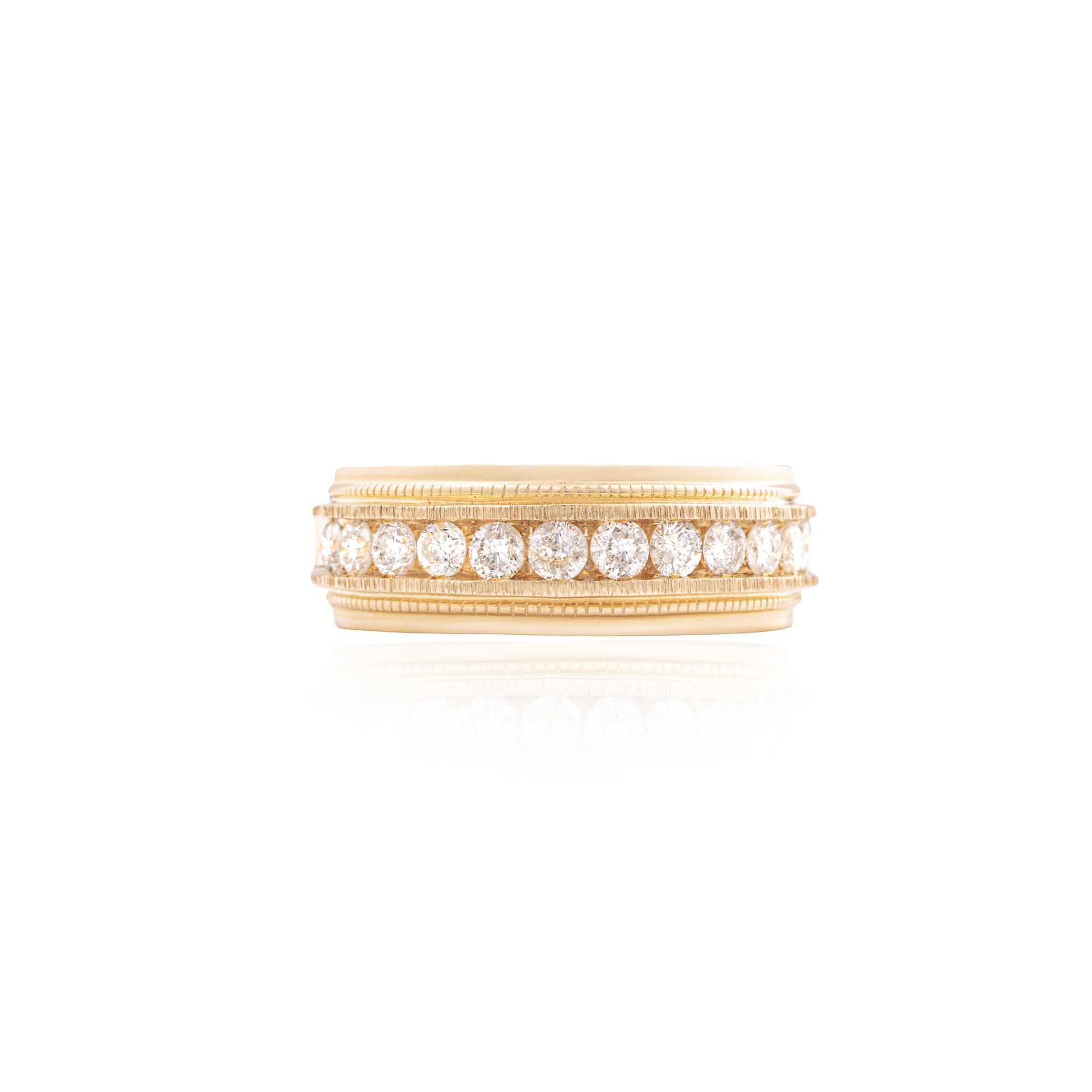 A yellow gold ring with diamonds on a white background.