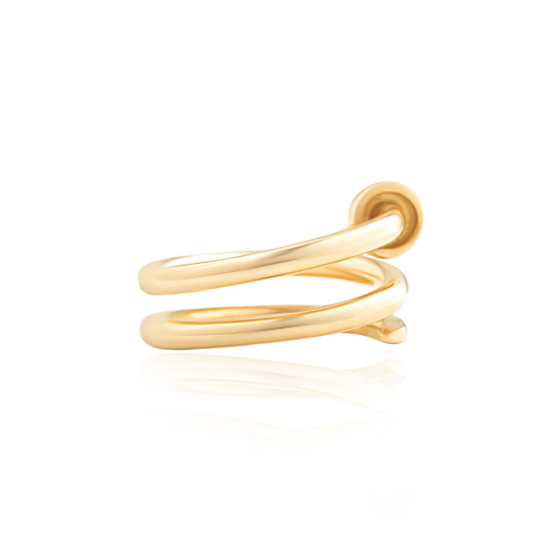 A close up of a gold ring on a white background