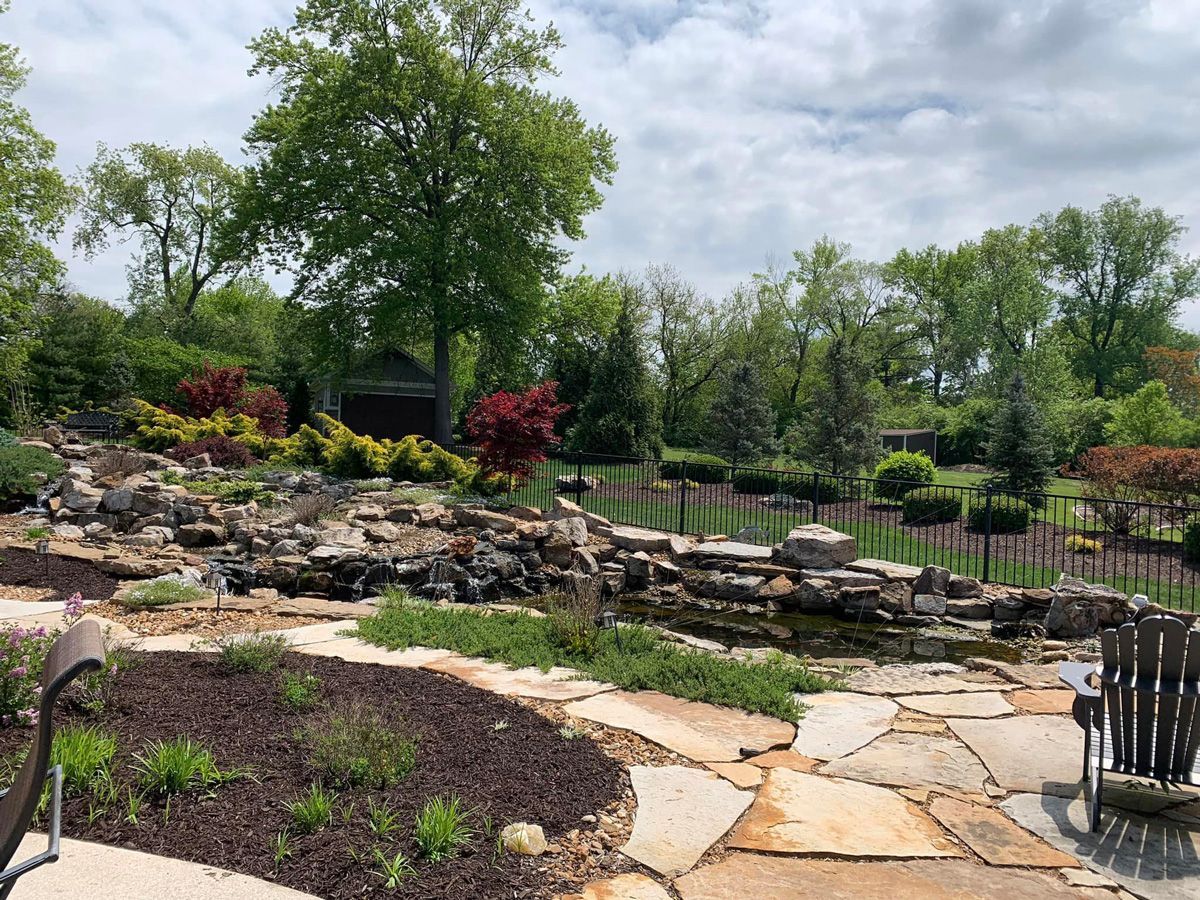 Stone Walkway Leading to a Pond — Saint Louis, MO — Zerr Lawn Care & Landscape LLC