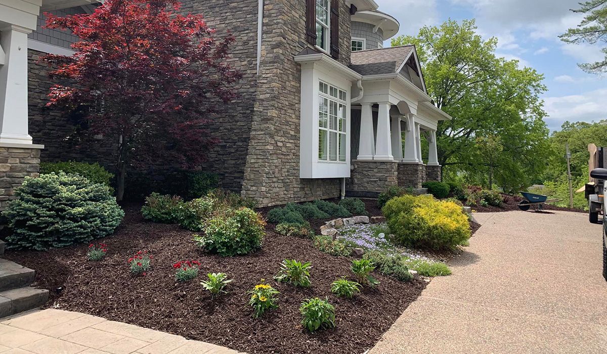 Large House with a Lot of Plants in Front — Saint Louis, MO — Zerr Lawn Care & Landscape LLC