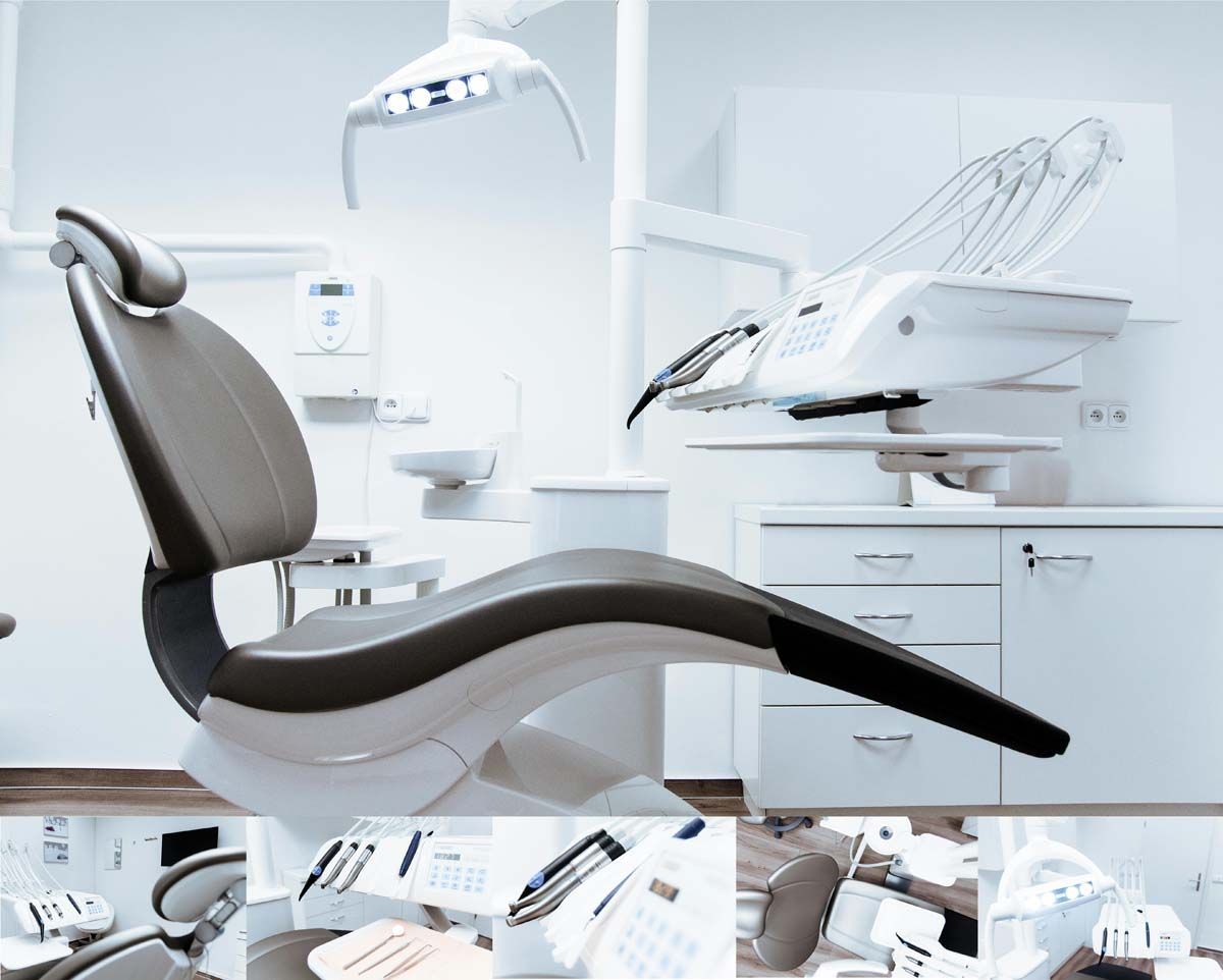 Dental chair in a sterile, white room with overhead light and dental equipment.