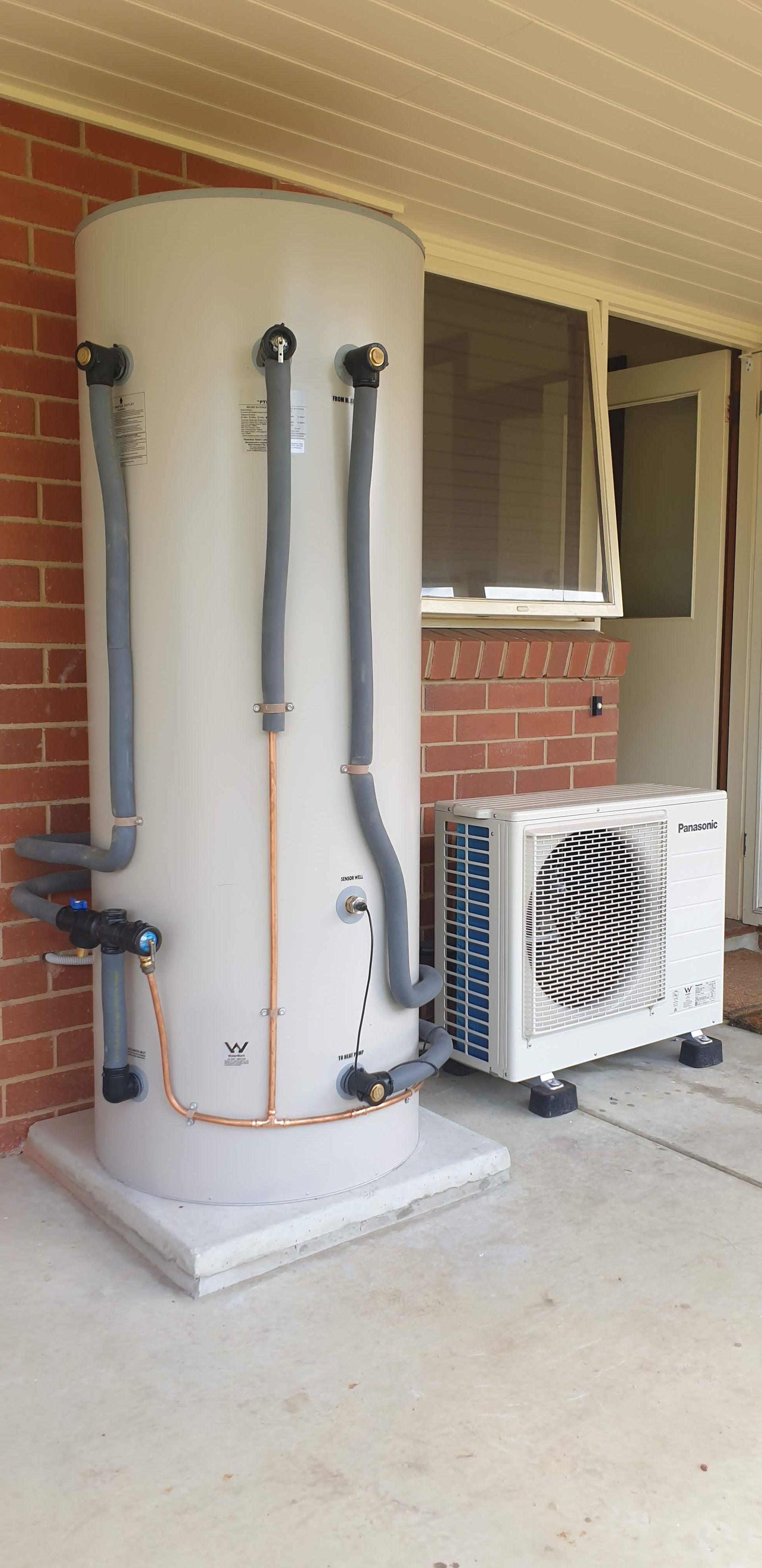 The Inside of A Heat Pump Is Shown with The Fan Removed — Sunworks Eco Plumbing In Torquay, VIC