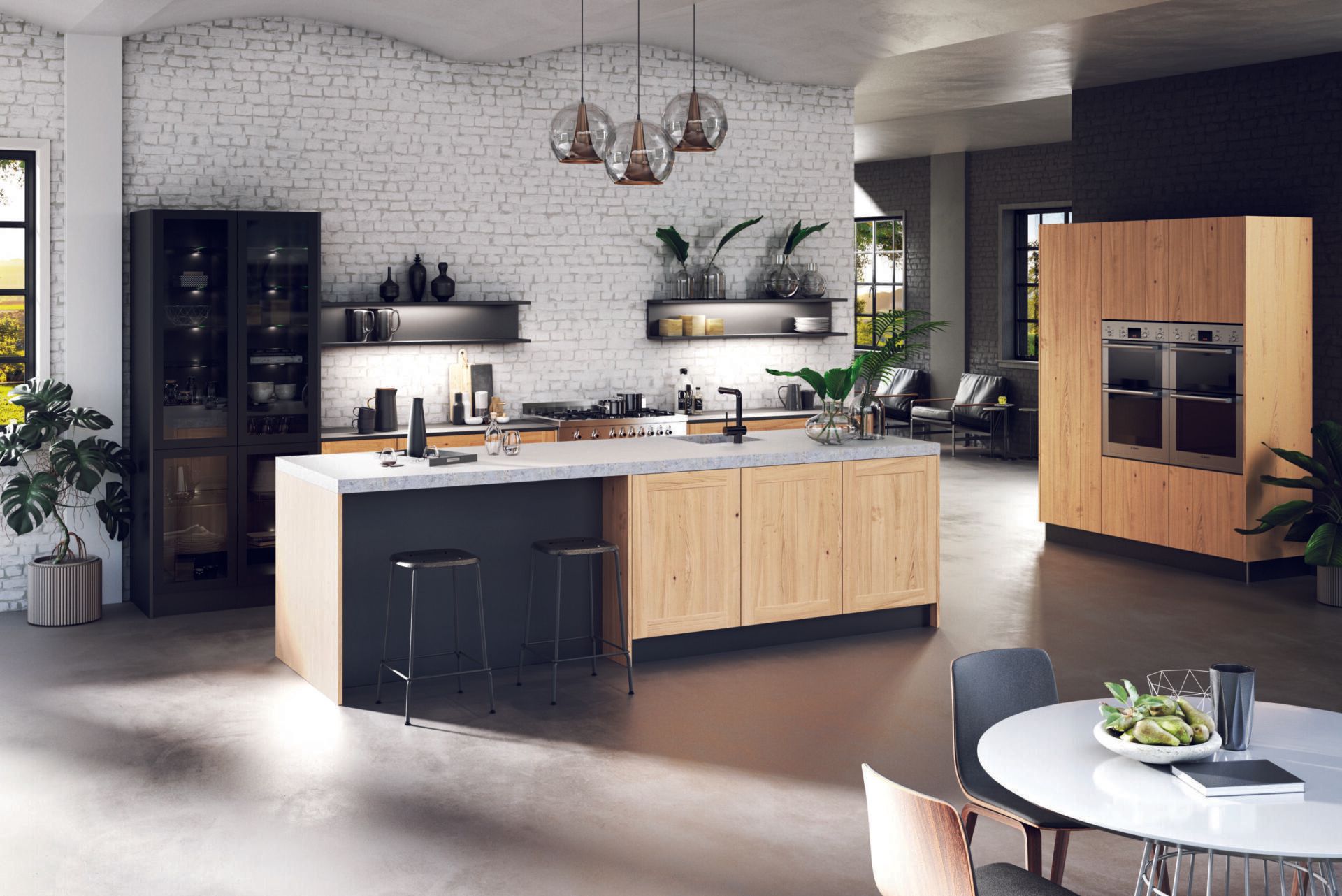 Een keuken met een groot kookeiland in het midden en een eettafel.