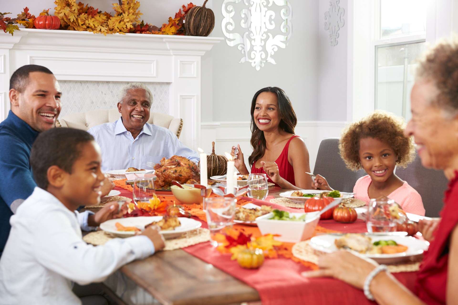 A family of six at the dinner table, sharing healthy holiday meals, and creating heartwarming memories together.