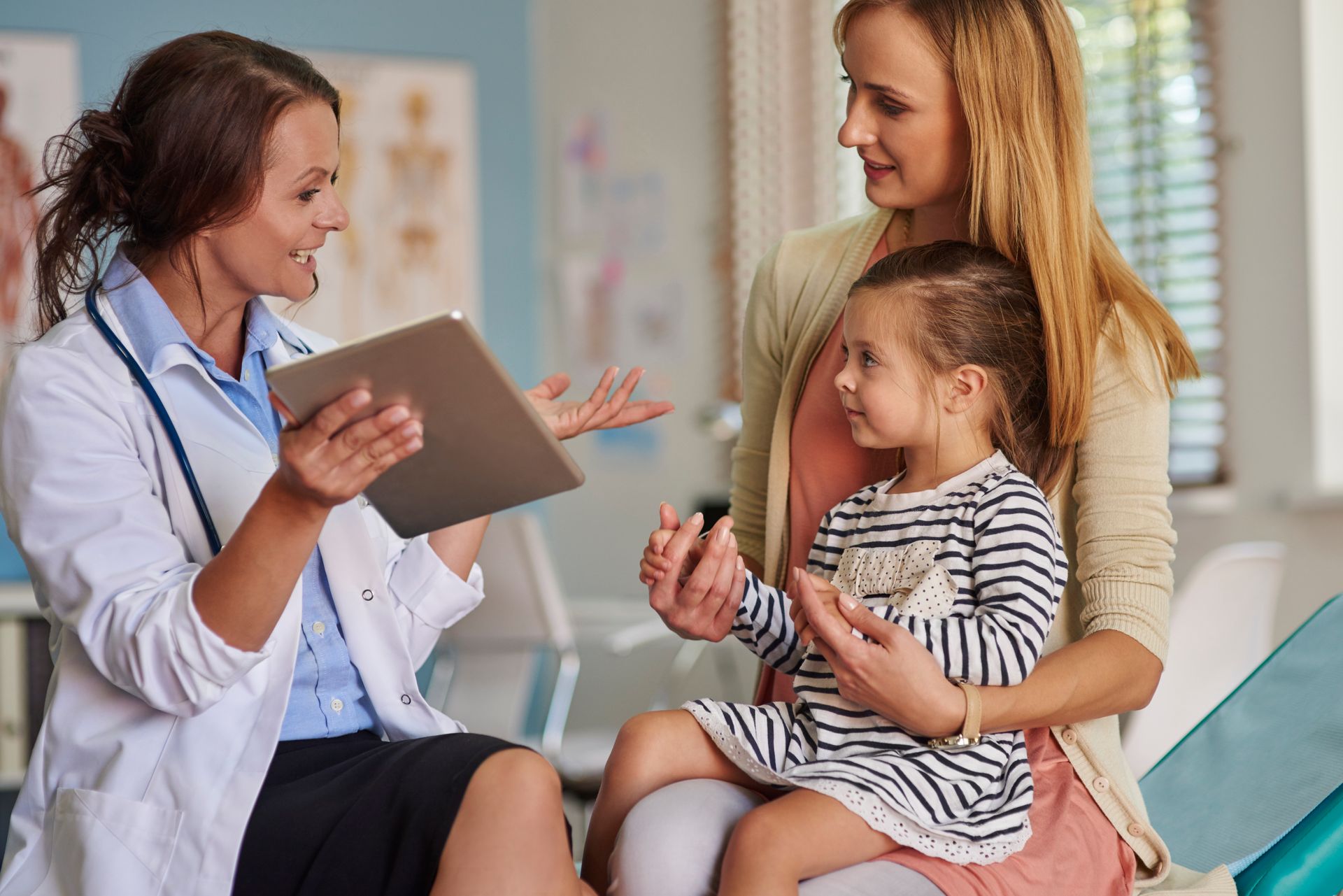 A mother takes her child to the doctor to learn about the importance of sun safety when playing outdoors.
