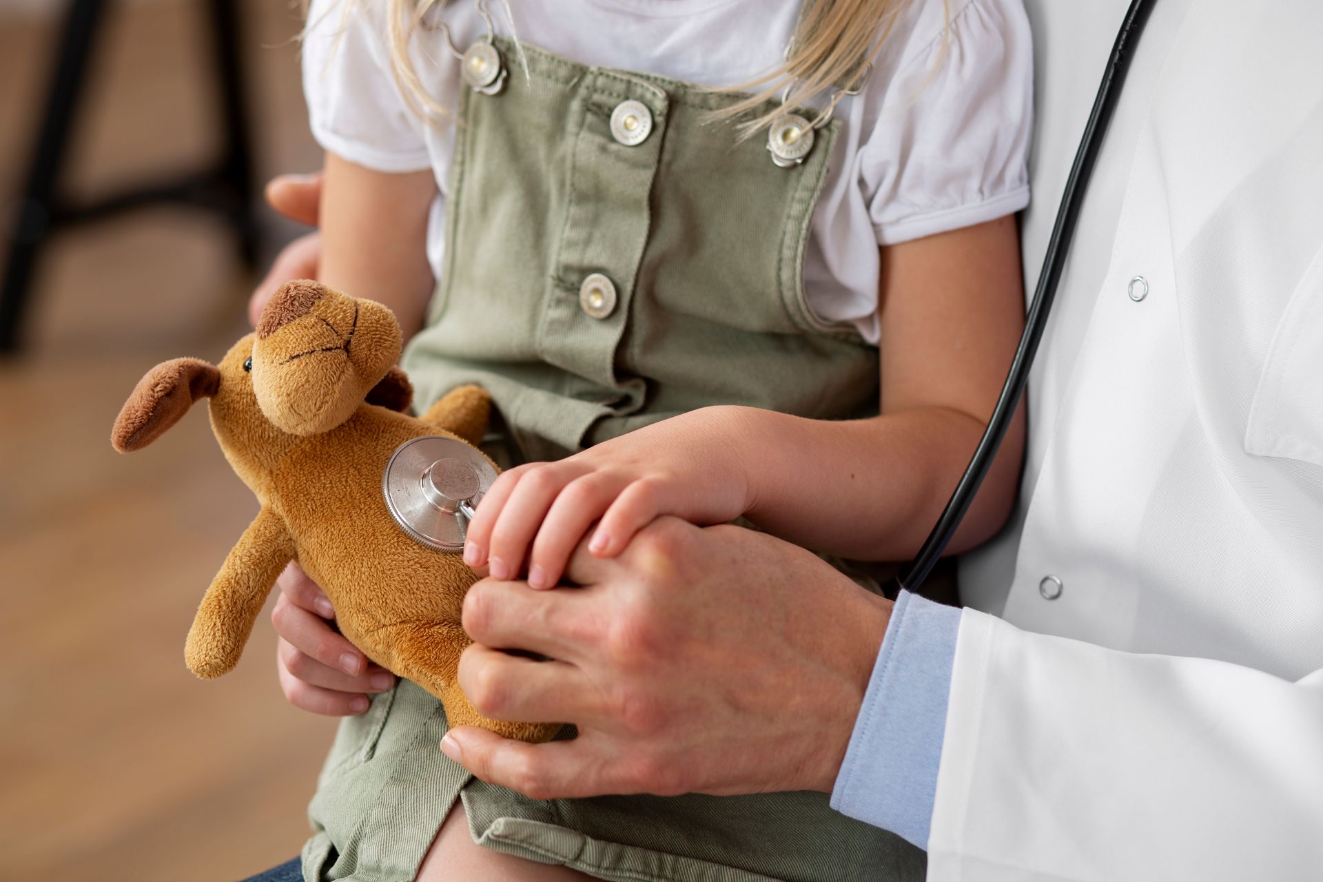 A healthcare professional ensures the child is hitting her developmental milestones.