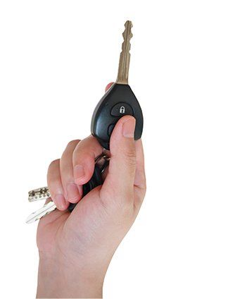 Hand Holding Car Keys - Lock Out Services in Klamath Falls, OR