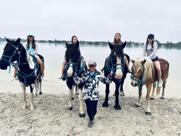 Group of girls horse back riding