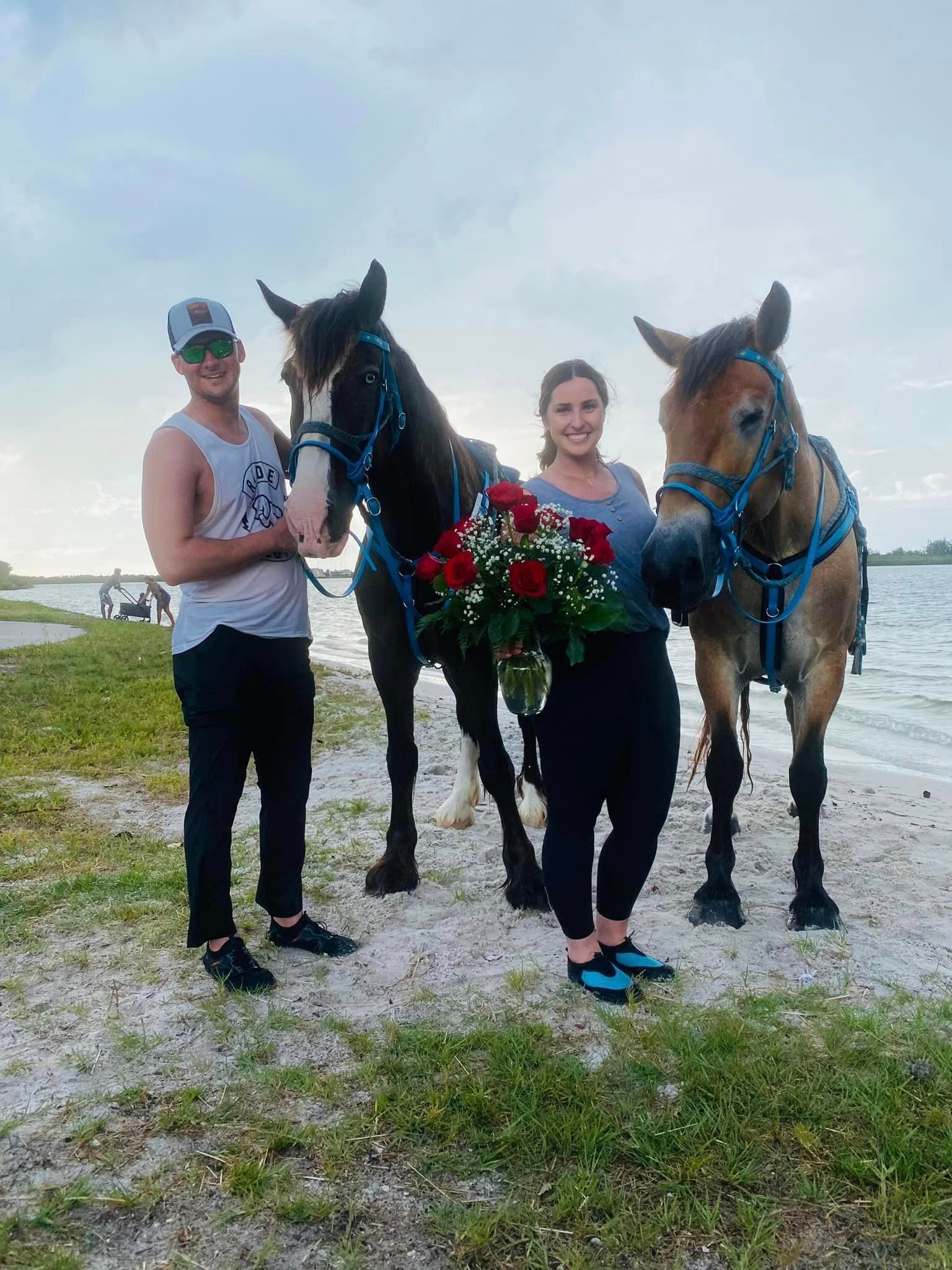 sweet couple with horses flowers