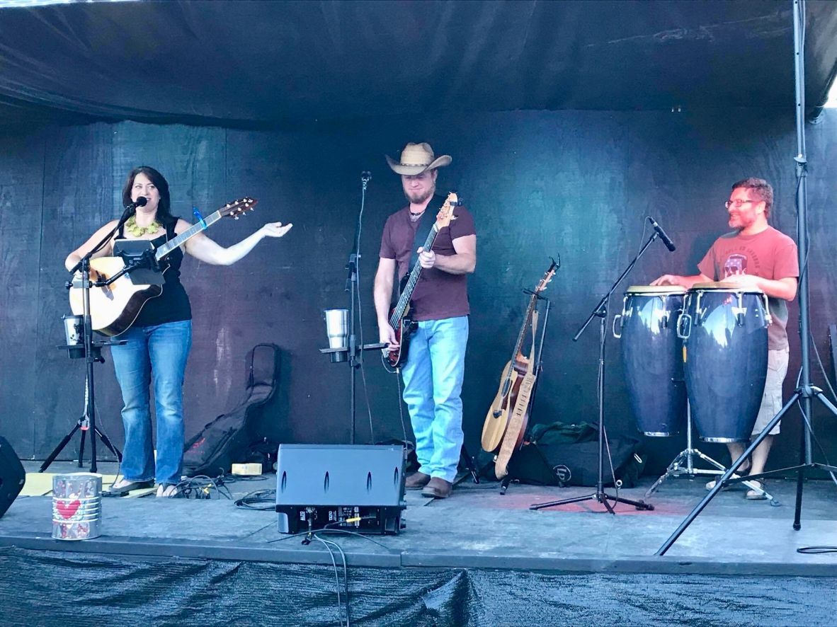 A group of people are playing instruments on a stage.