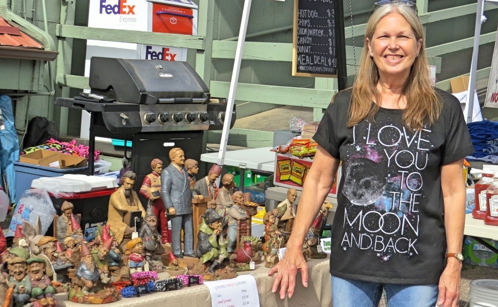 A woman wearing a t-shirt that says i love you to the moon and back