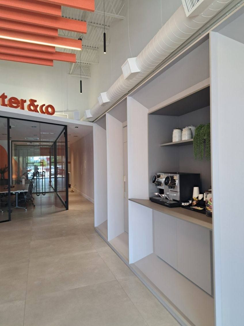 A hallway with a sign that says ter & co on it