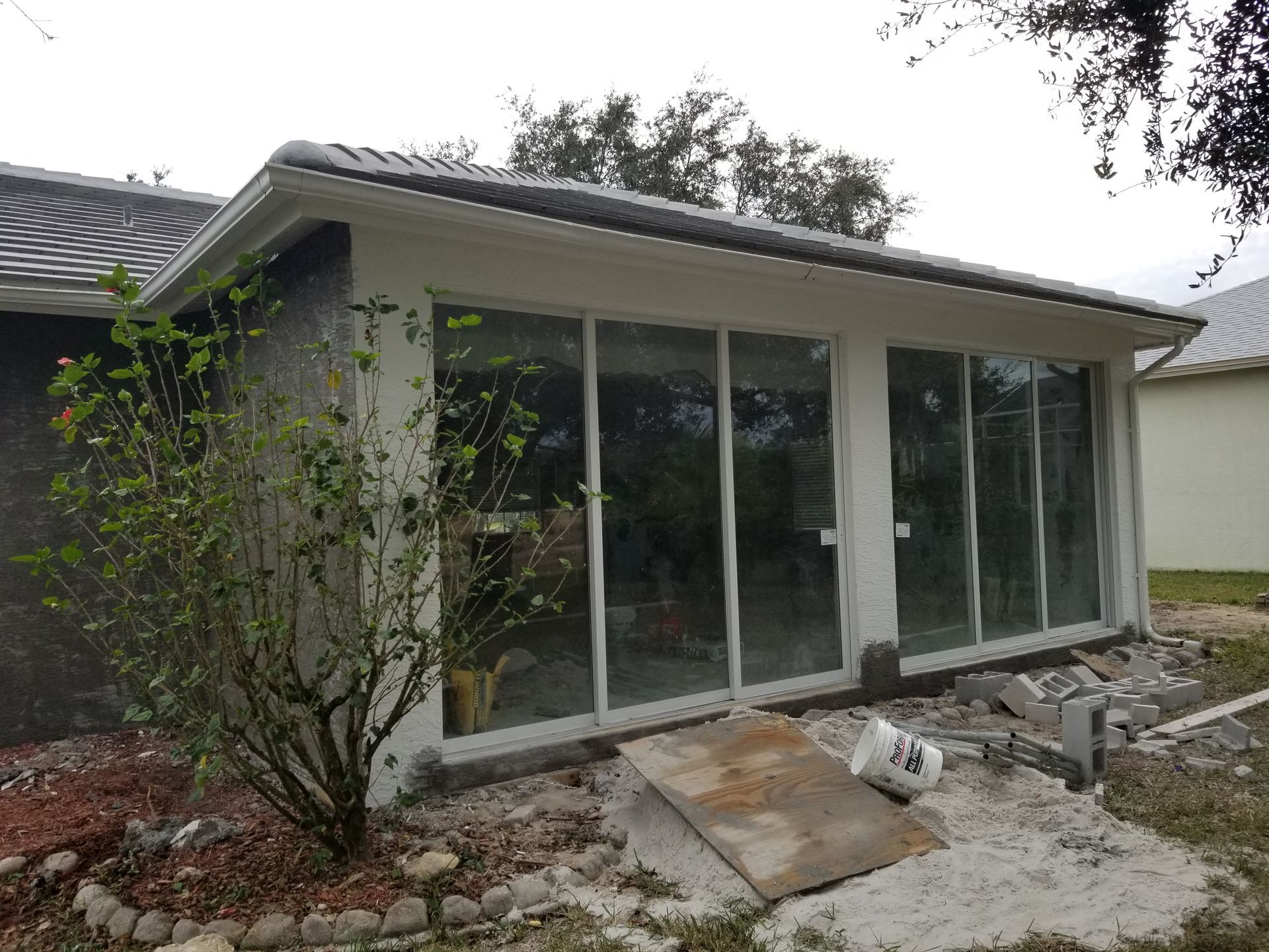 A house with a lot of windows is being built.