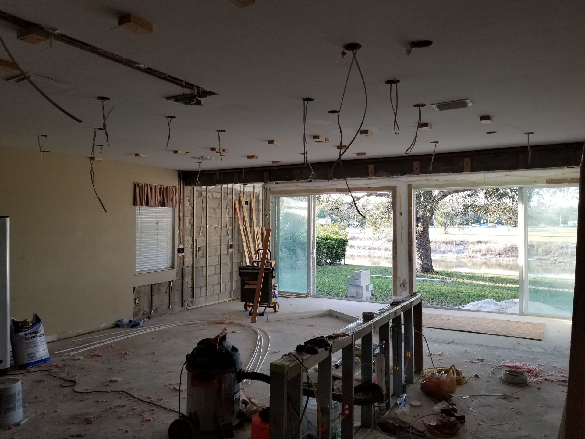 A room with a lot of wires hanging from the ceiling