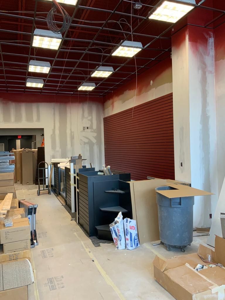 A large room with a lot of boxes on the floor