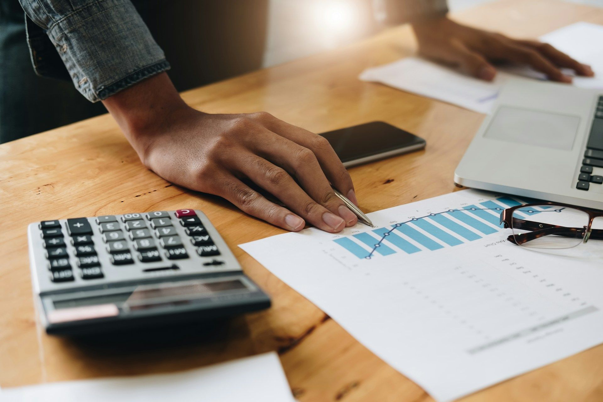 Snowy urban street with brick buildings and a skyway connecting them.