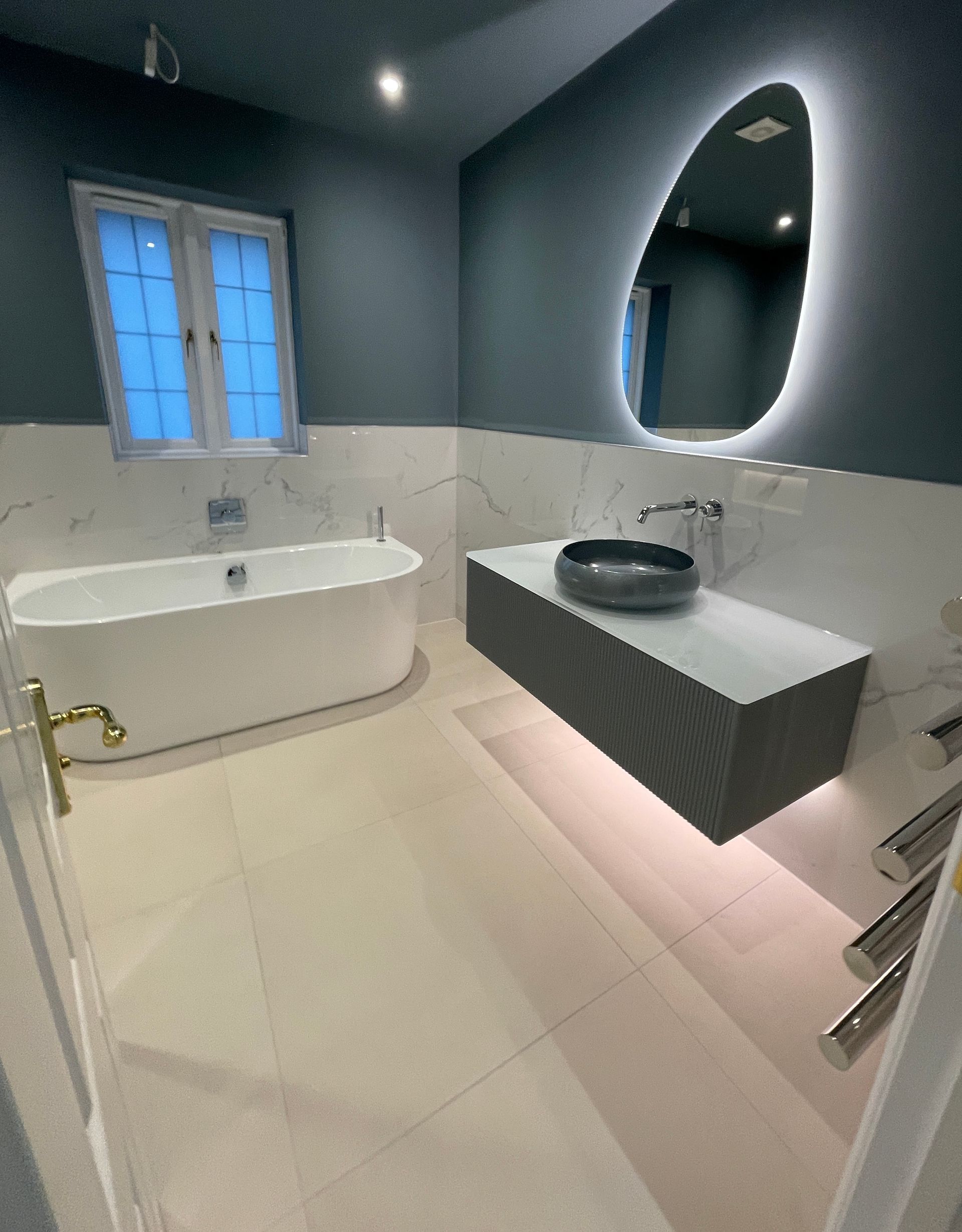 A classic style bathroom with a freestanding, claw foot style bath designed and fitted by Options Bath and Tile Studio Ascot.